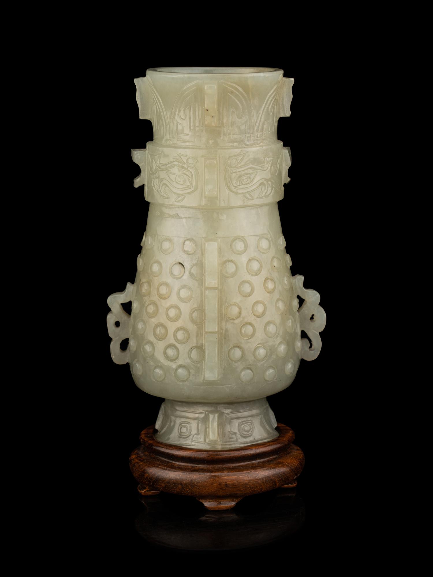 A Carved Pale Celadon Jade Hu Vase
