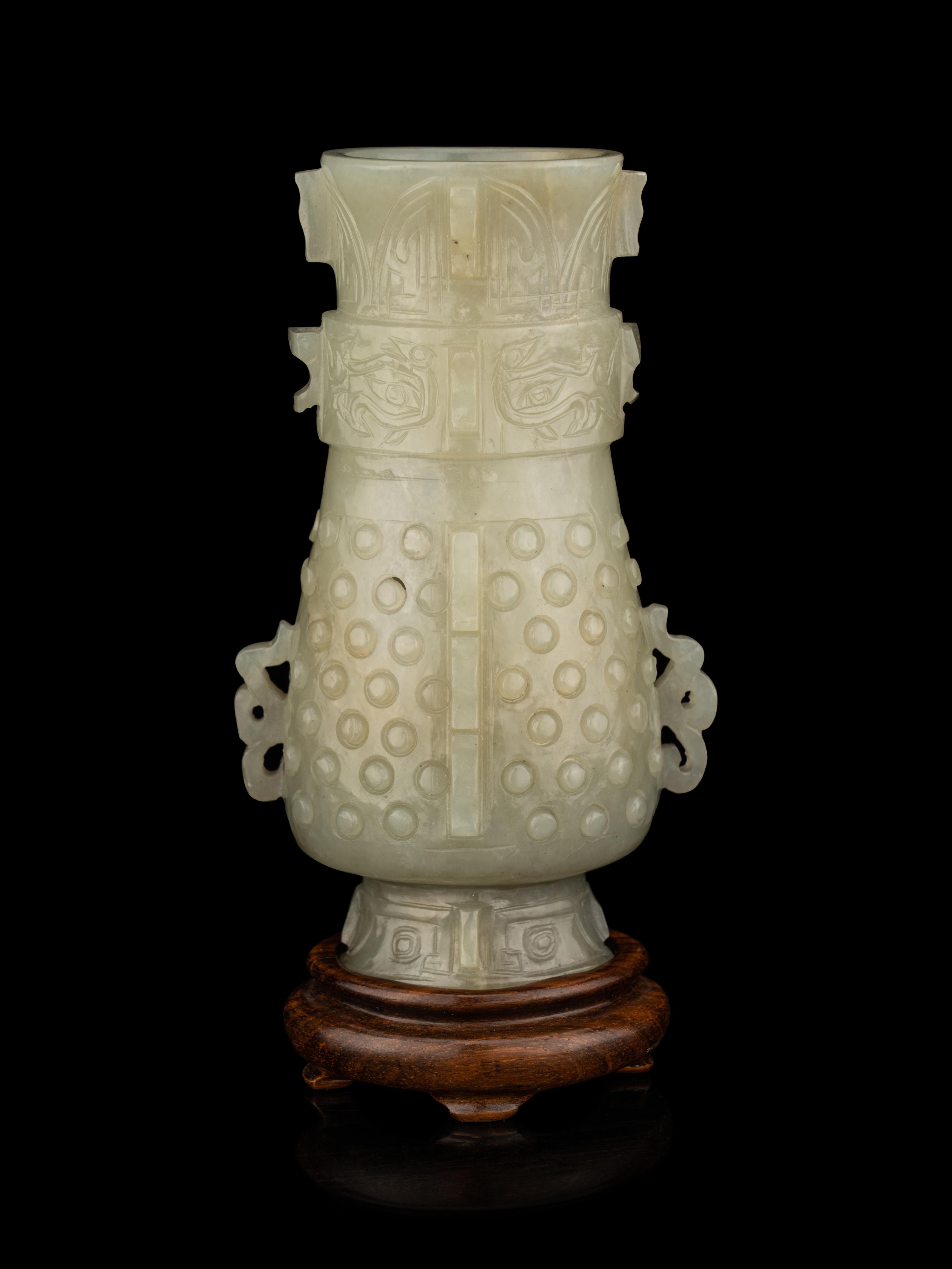 A Carved Pale Celadon Jade Hu Vase