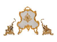 A Pair of Louis XV Style Gilt Bronze Chenets and a Similar Fire Screen