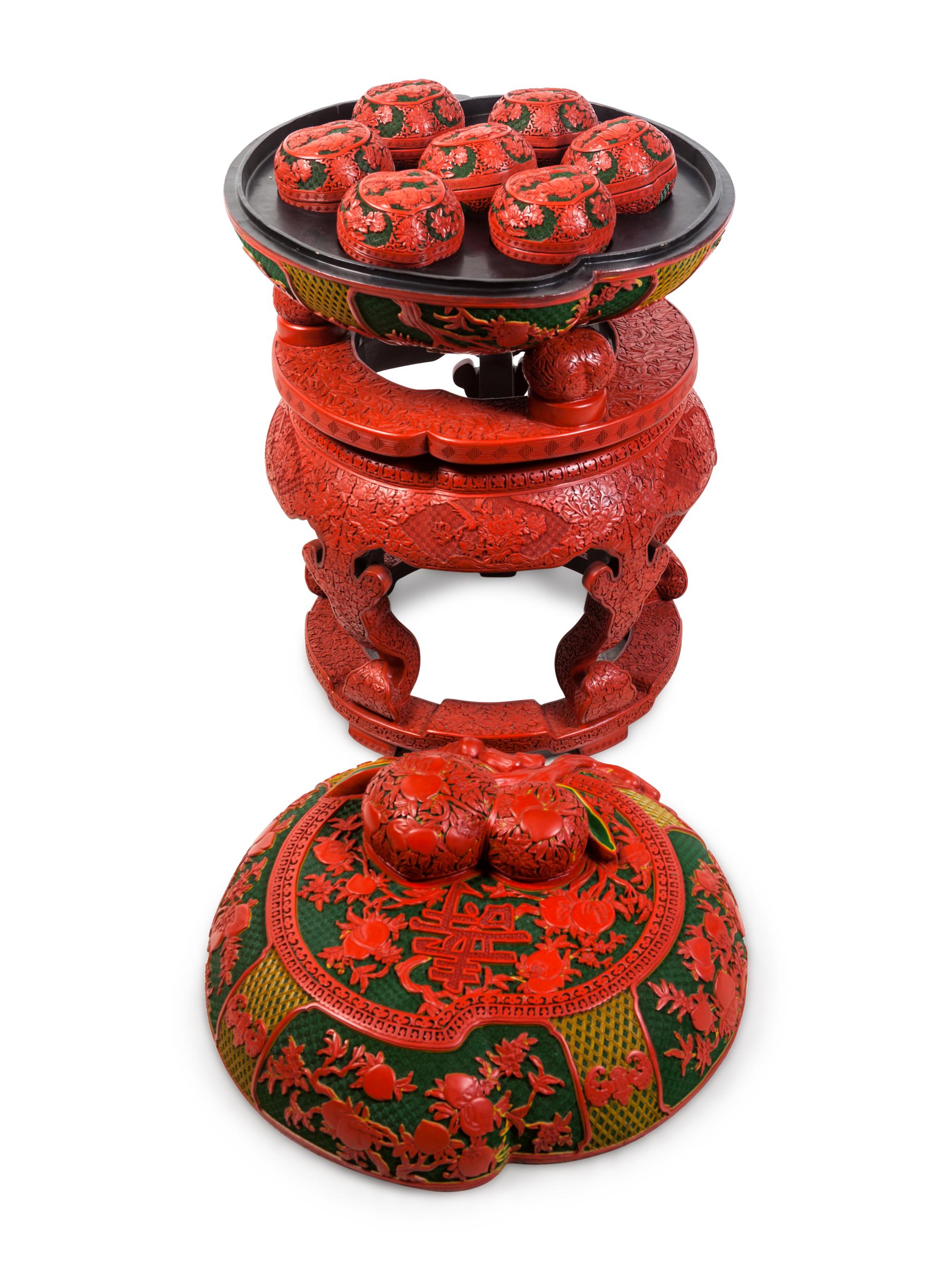 A Set of Chinese Export Carved Red Lacquer "Peach" Nesting Boxes and a Stand