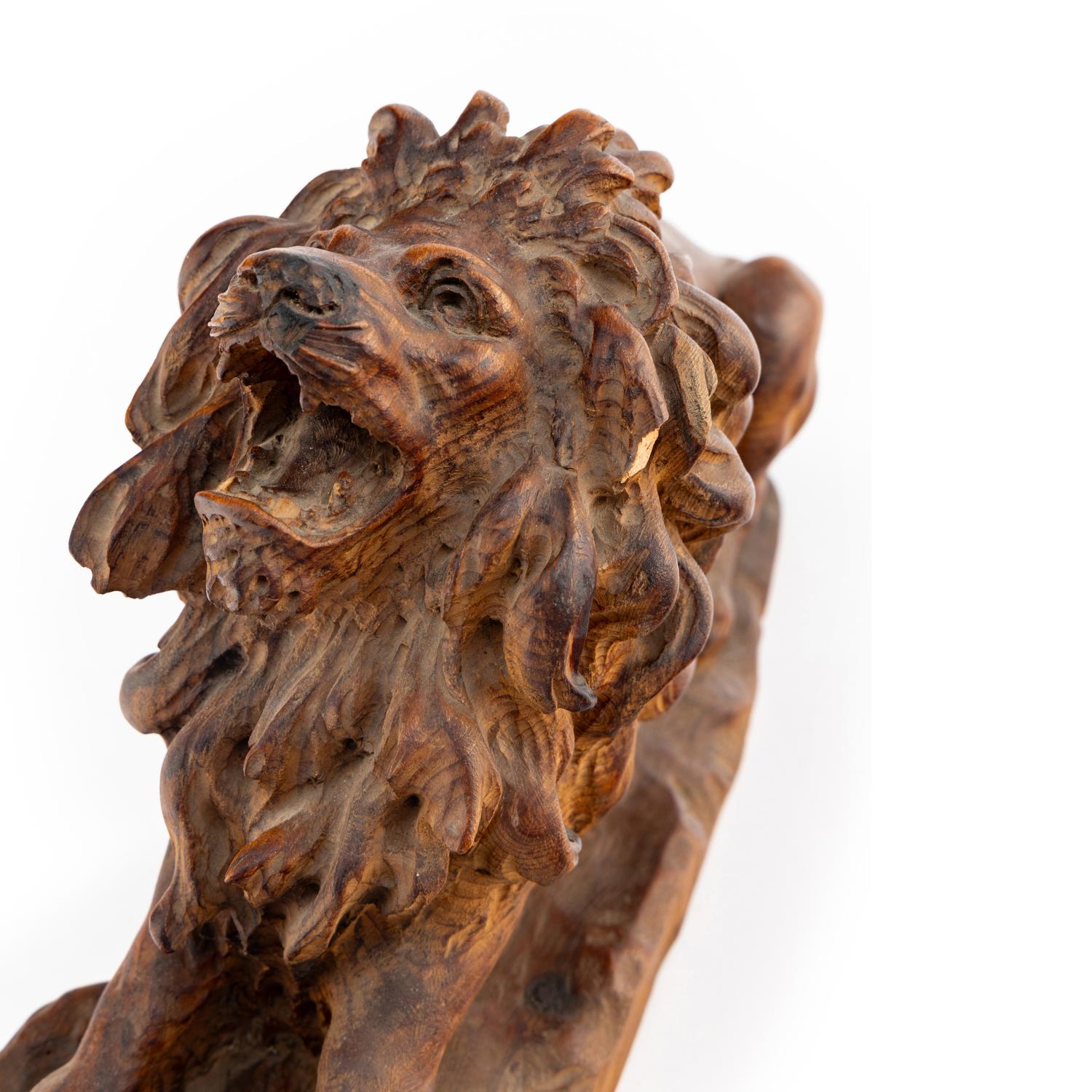 A Carved Oak Model of a Lion