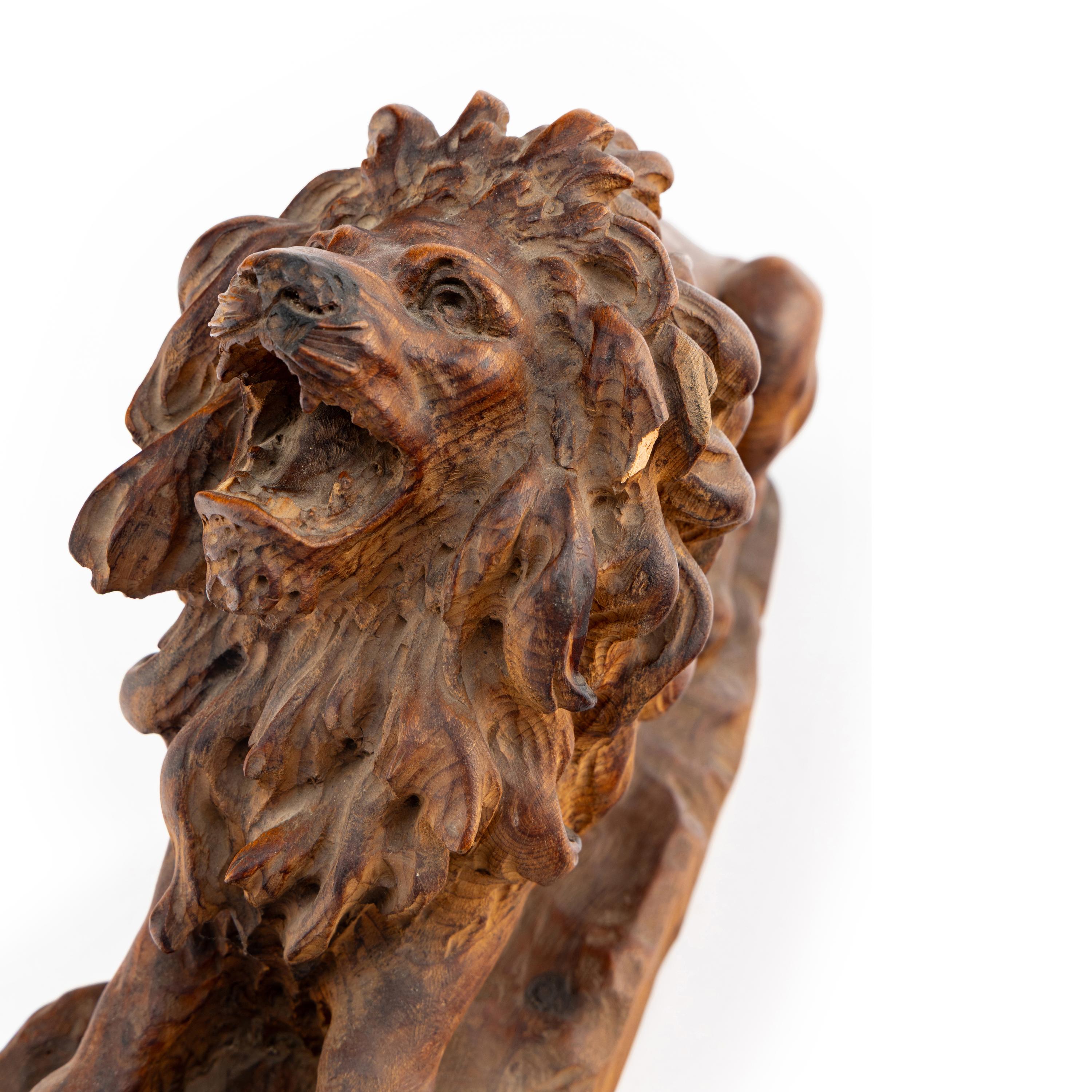 A Carved Oak Model of a Lion