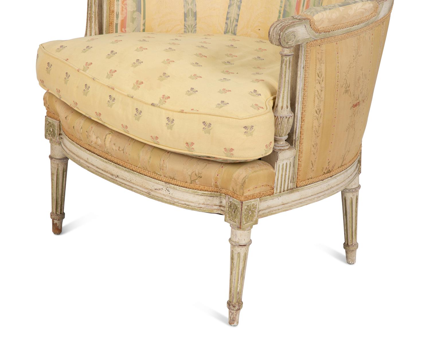 A Pair of Louis XVI Style Painted and Upholstered Bergeres — 20TH CENTURY