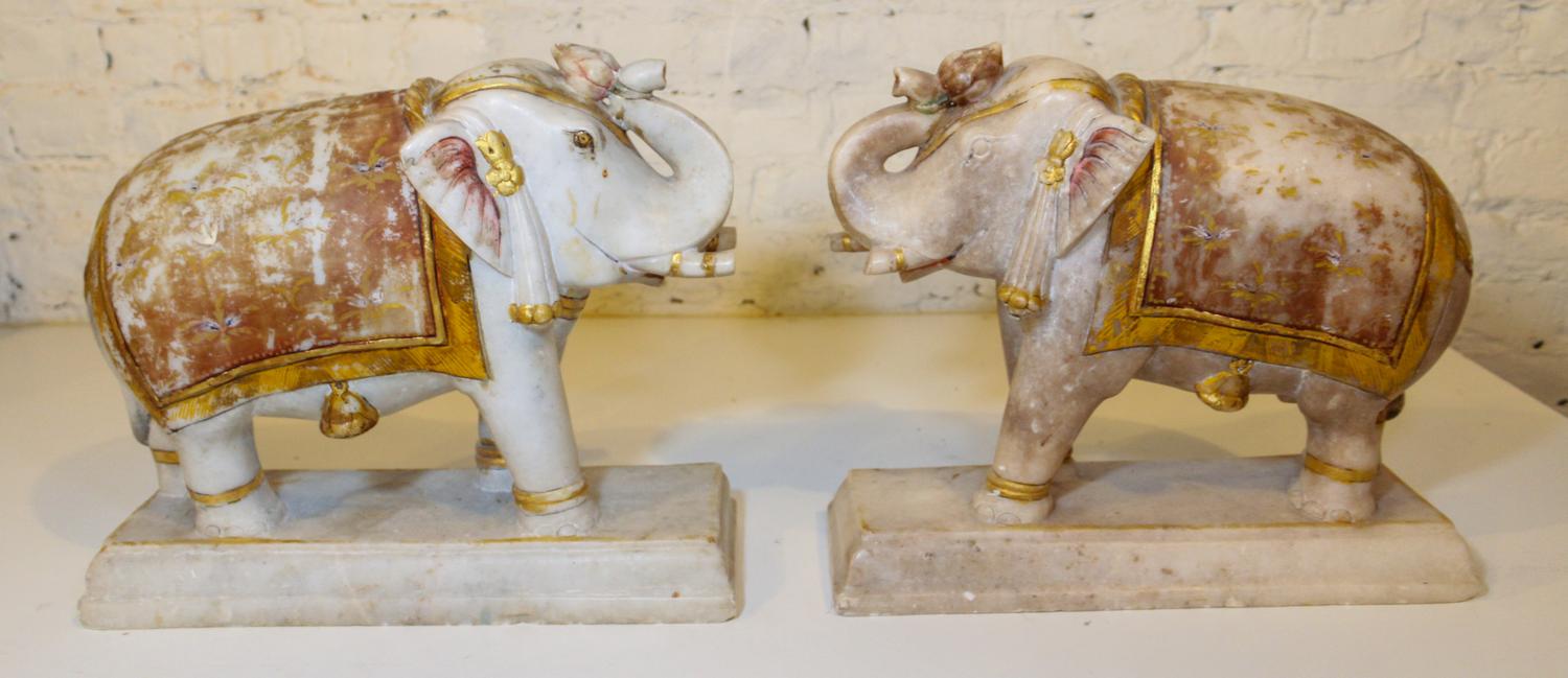 A Pair of Gilt-Decorated Indian Elephant Sculptures Height 13 x width 16 x depth 9 1/2 inches. — INDIA, 20TH CENTURY