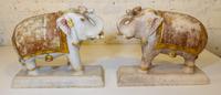 A Pair of Gilt-Decorated Indian Elephant Sculptures Height 13 x width 16 x depth 9 1/2 inches. — INDIA, 20TH CENTURY