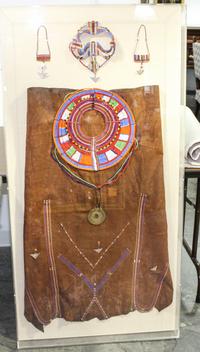 A Framed Group of African Beadwork Articles. Height of frame 55 x width 27 inches.