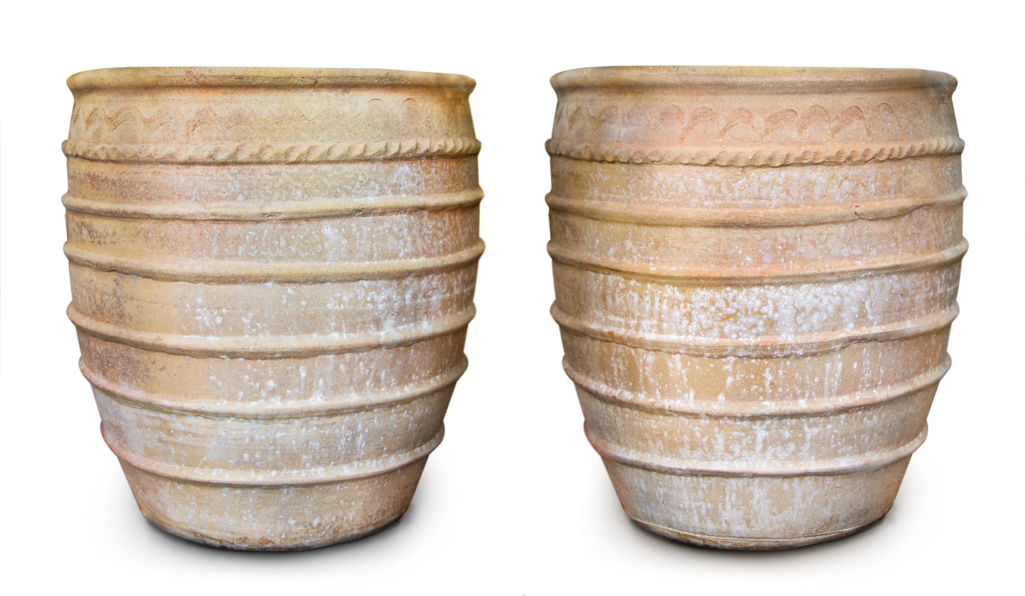 A Pair of Concrete Planters Height 24 1/2 inches.