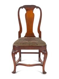 A Queen Anne Volute Carved Walnut Flat-Stretcher Pad-Foot Side Chair