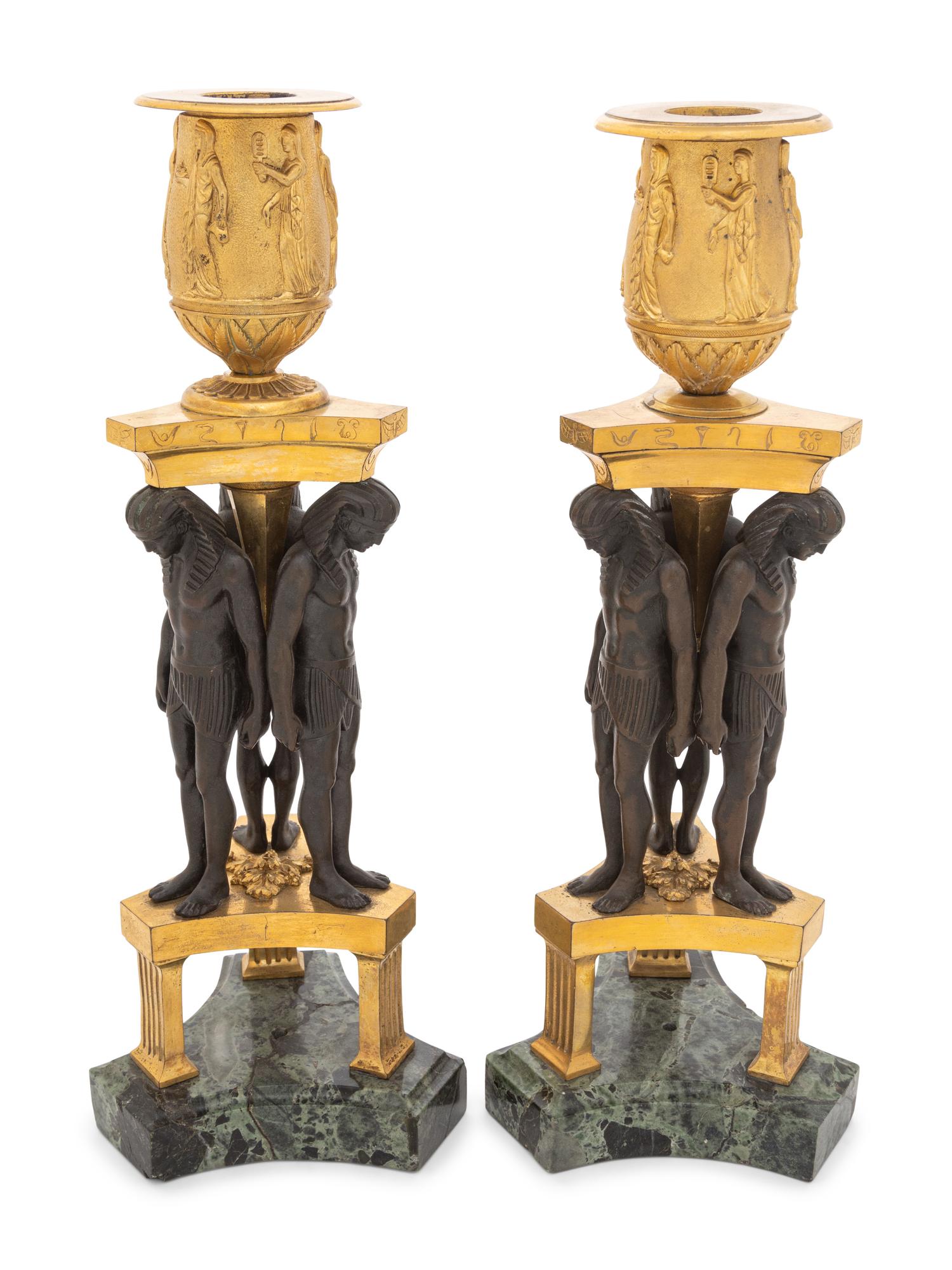A Pair of French Egyptian Revival Bronze and Marble Candlesticks
