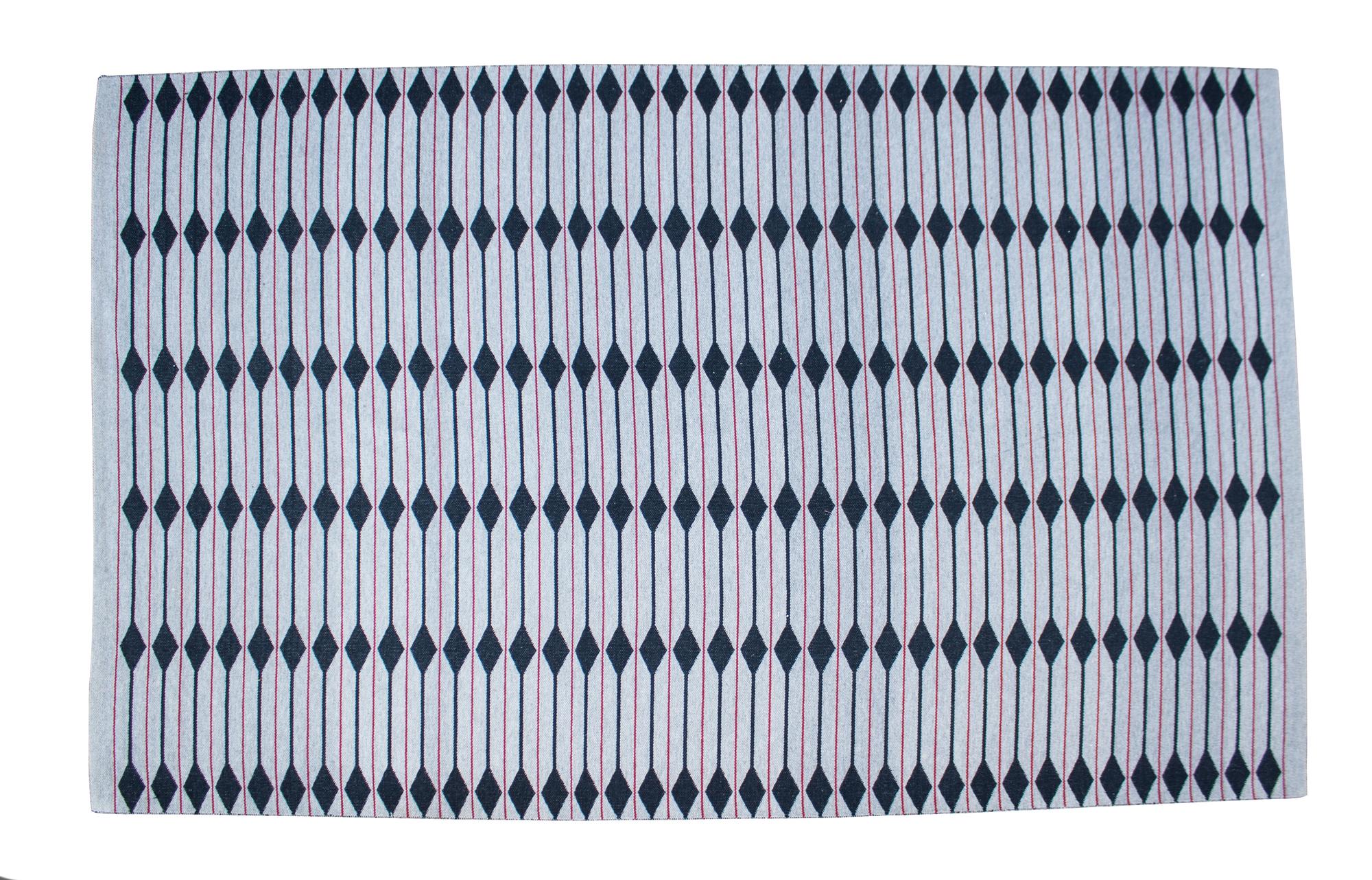 A Contemporary Wool Rug 9 feet 2 inches x 5 feet 9 inches.