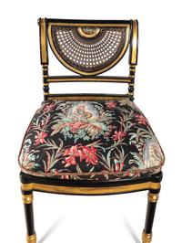 A Set of Eight Regency Style Black Painted and Parcel Gilt Dining Chairs