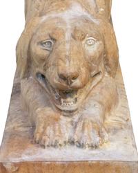 A Pair of Carved Marble Crouching Dogs — 20TH CENTURY