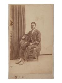 [EARLY PHOTOGRAPHY]. Occupational CDV portrait of an African American individual, possibly a railway porter.
