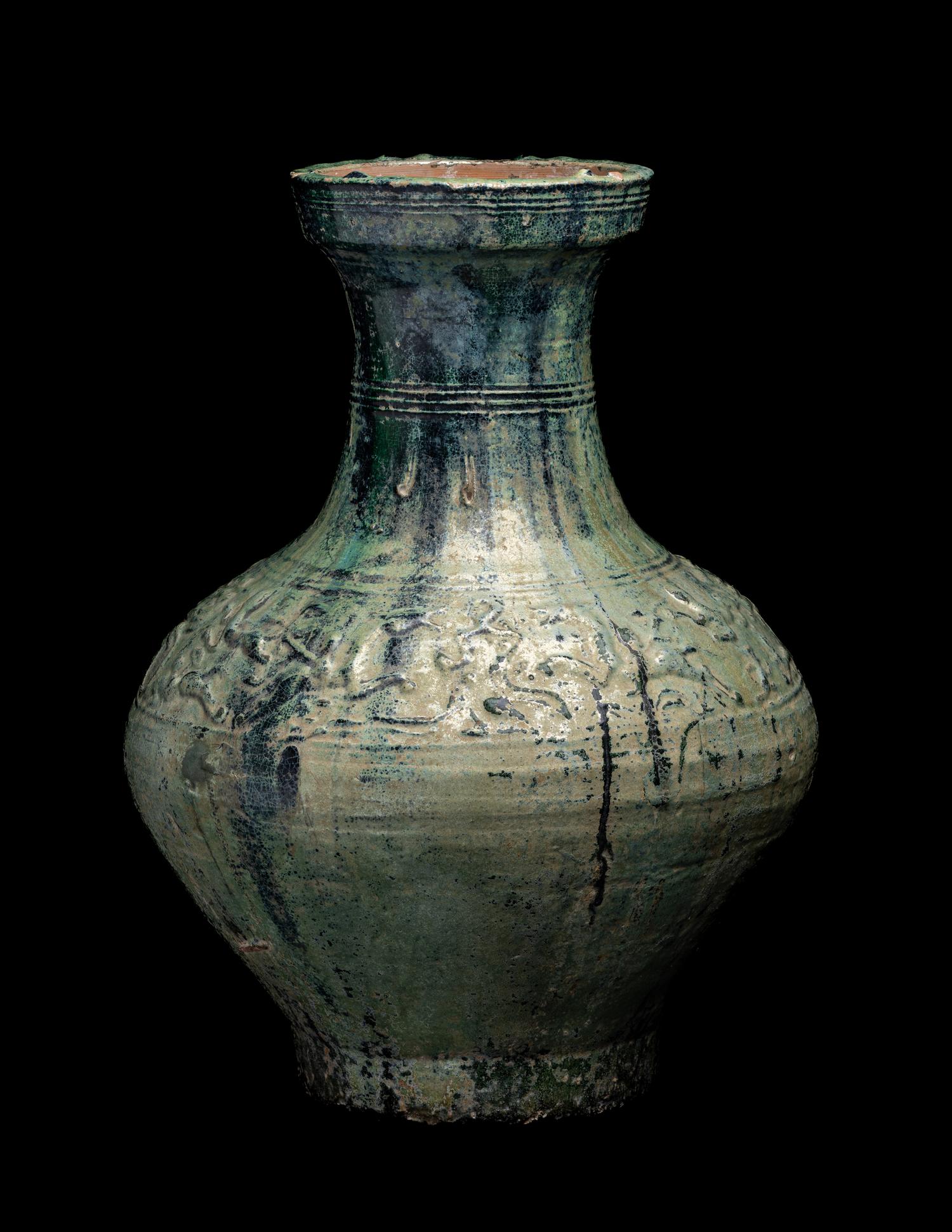 A Chinese Molded Green Glazed Pottery Hu Vase
