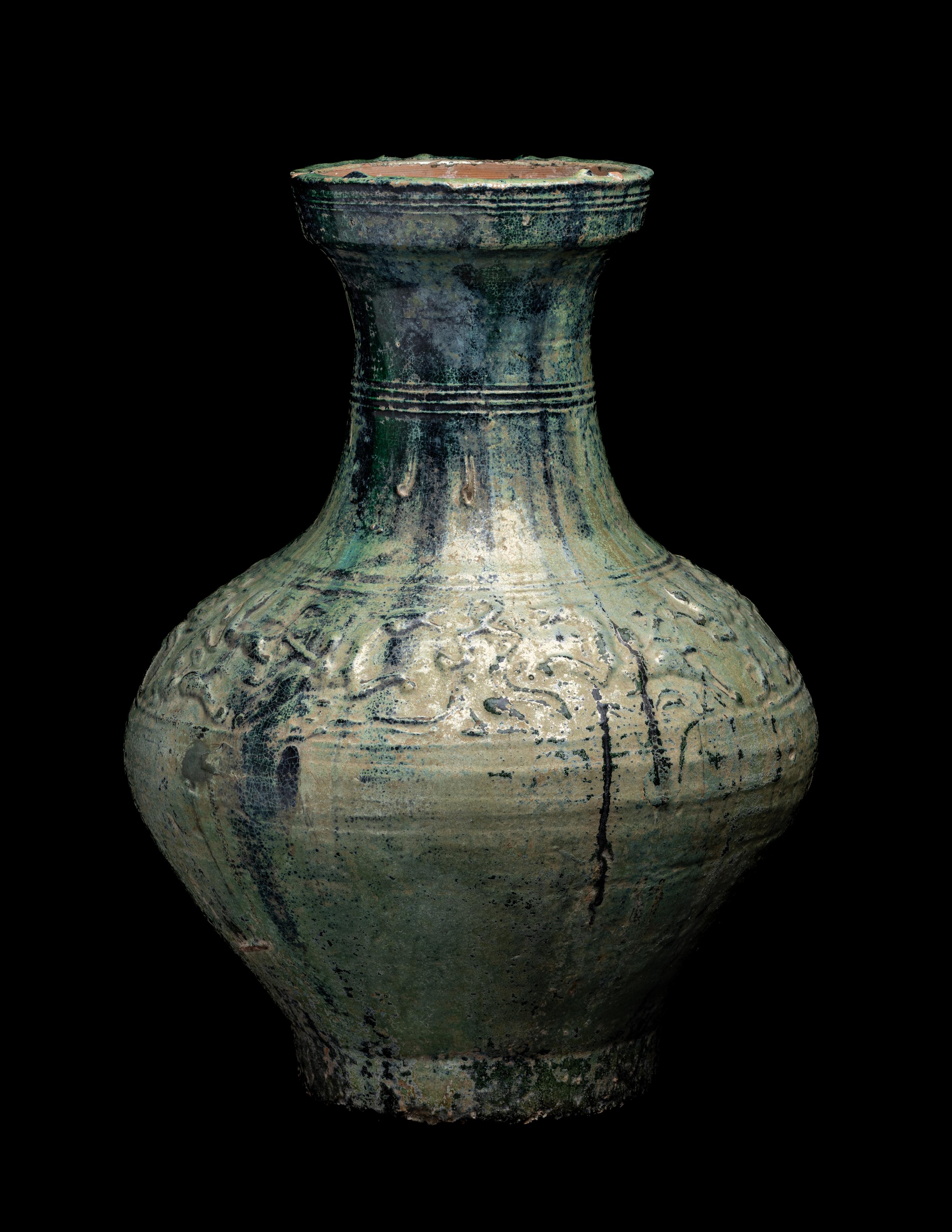 A Chinese Molded Green Glazed Pottery Hu Vase