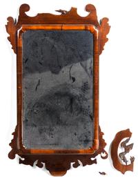 A Carved Wood Mirror Height 37 x width 19 1/2 inches.