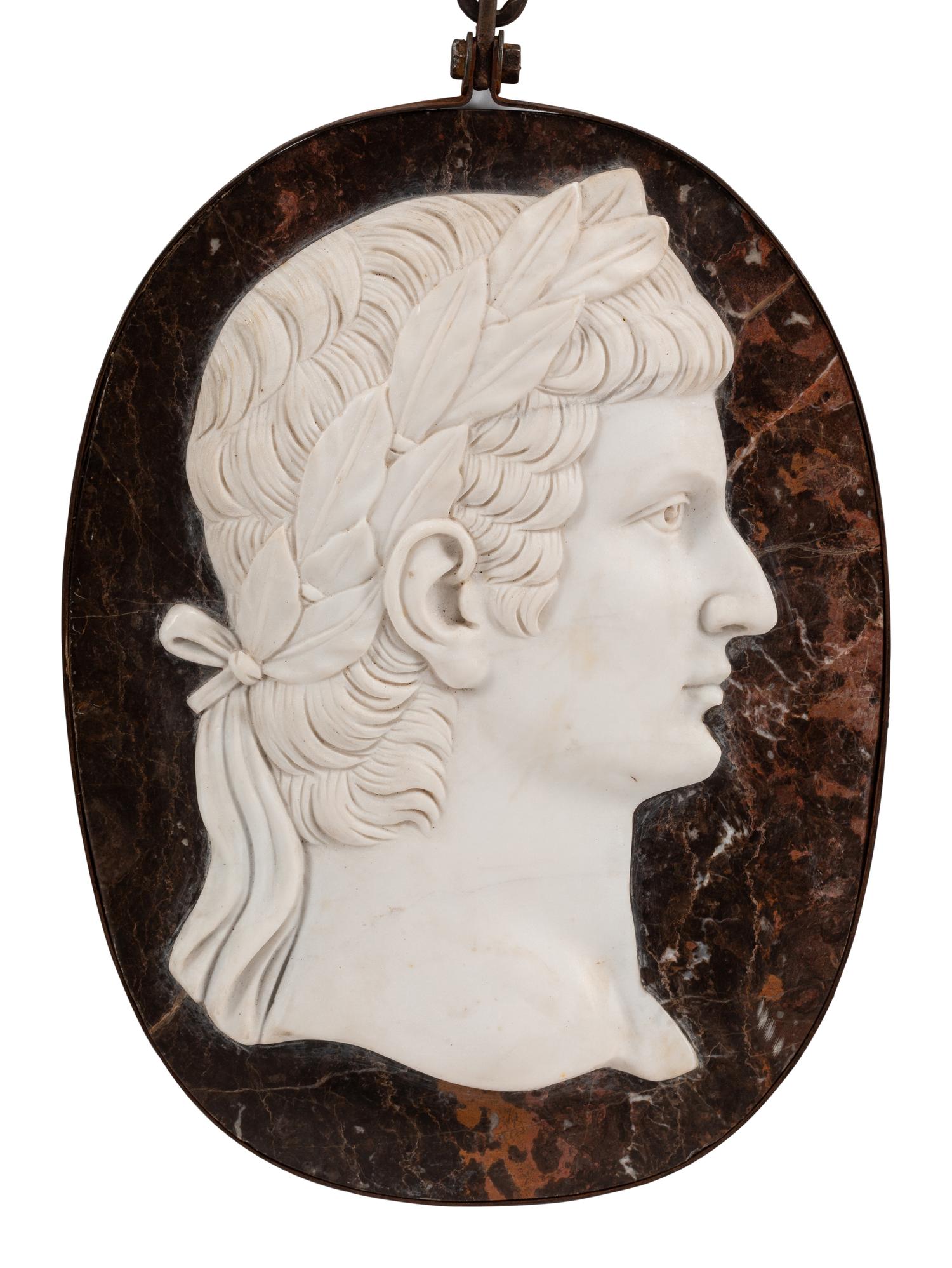 A Set of Four Italian Neoclassical Style Iron Mounted Marble Portrait Medallions