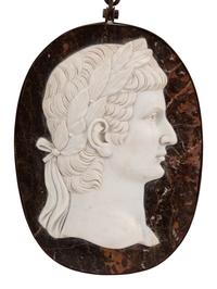 A Set of Four Italian Neoclassical Style Iron Mounted Marble Portrait Medallions