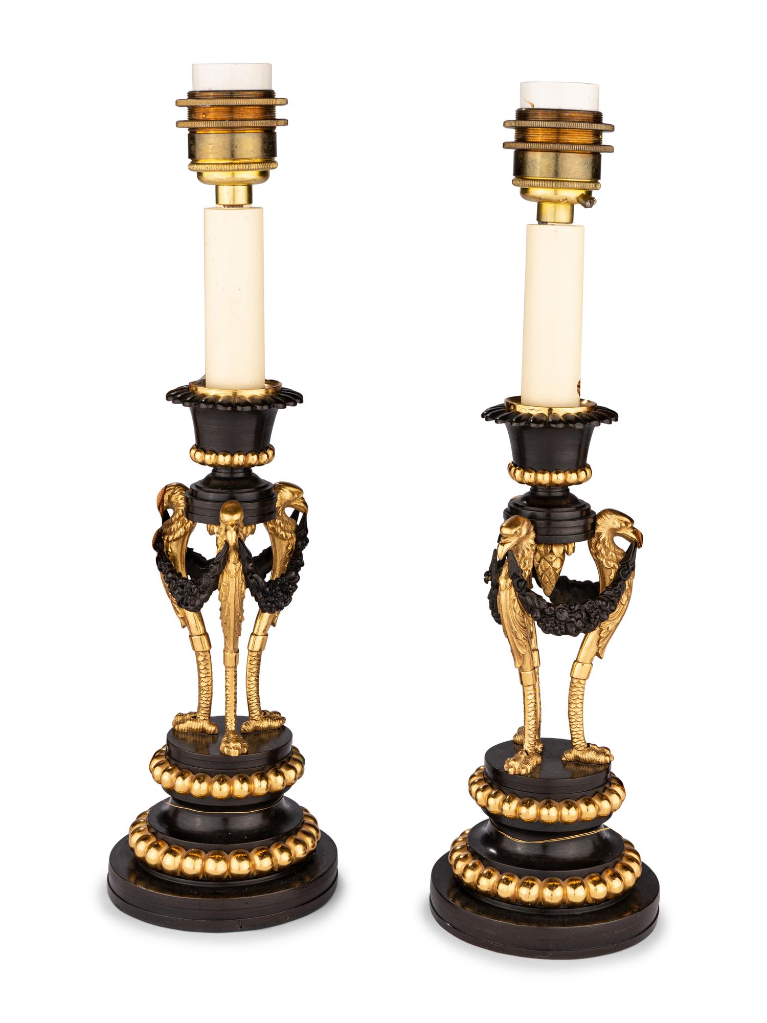 A Pair of Directoire Parcel-Gilt Bronze Candlesticks