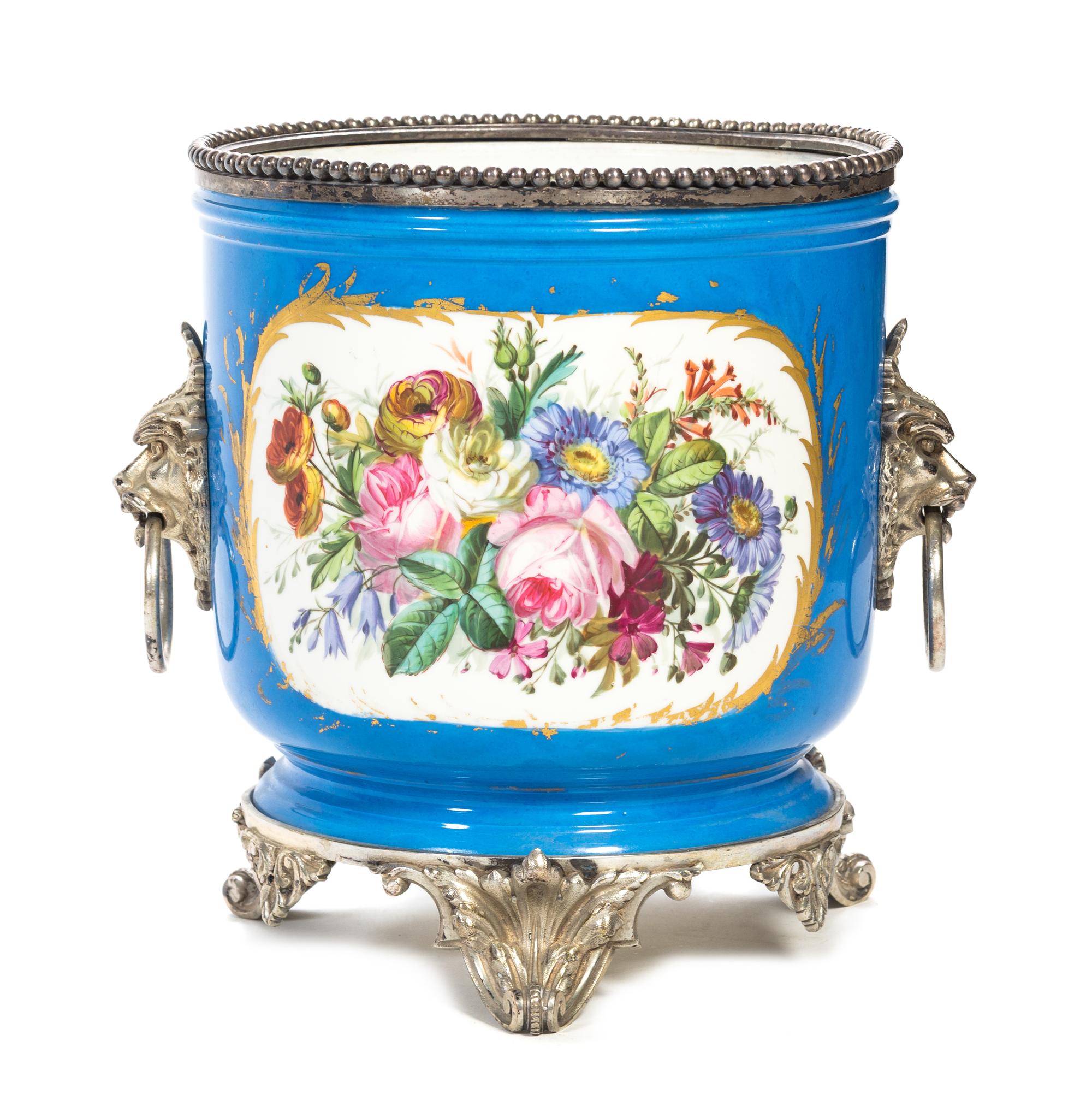A Silvered Bronze Mounted Sevres Style Porcelain Jardiniere Height 12 x diameter 10 1/2 inches.