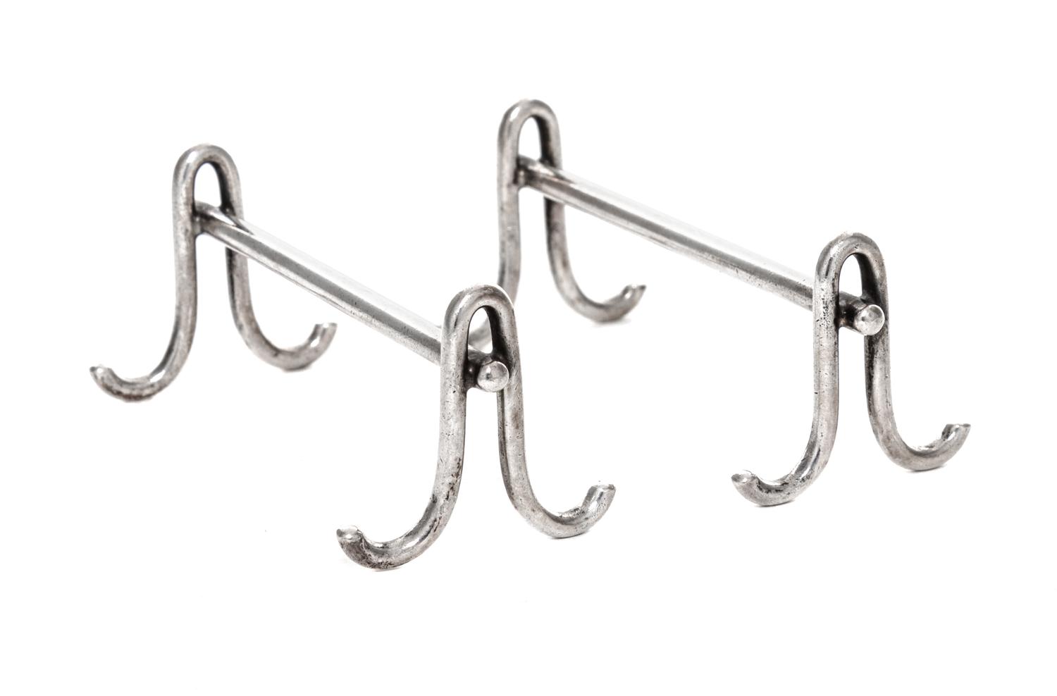 A Pair of American Silver Knife Rests, Gorham Mfg. Co., Providence, RI, each raised on two shaped supports