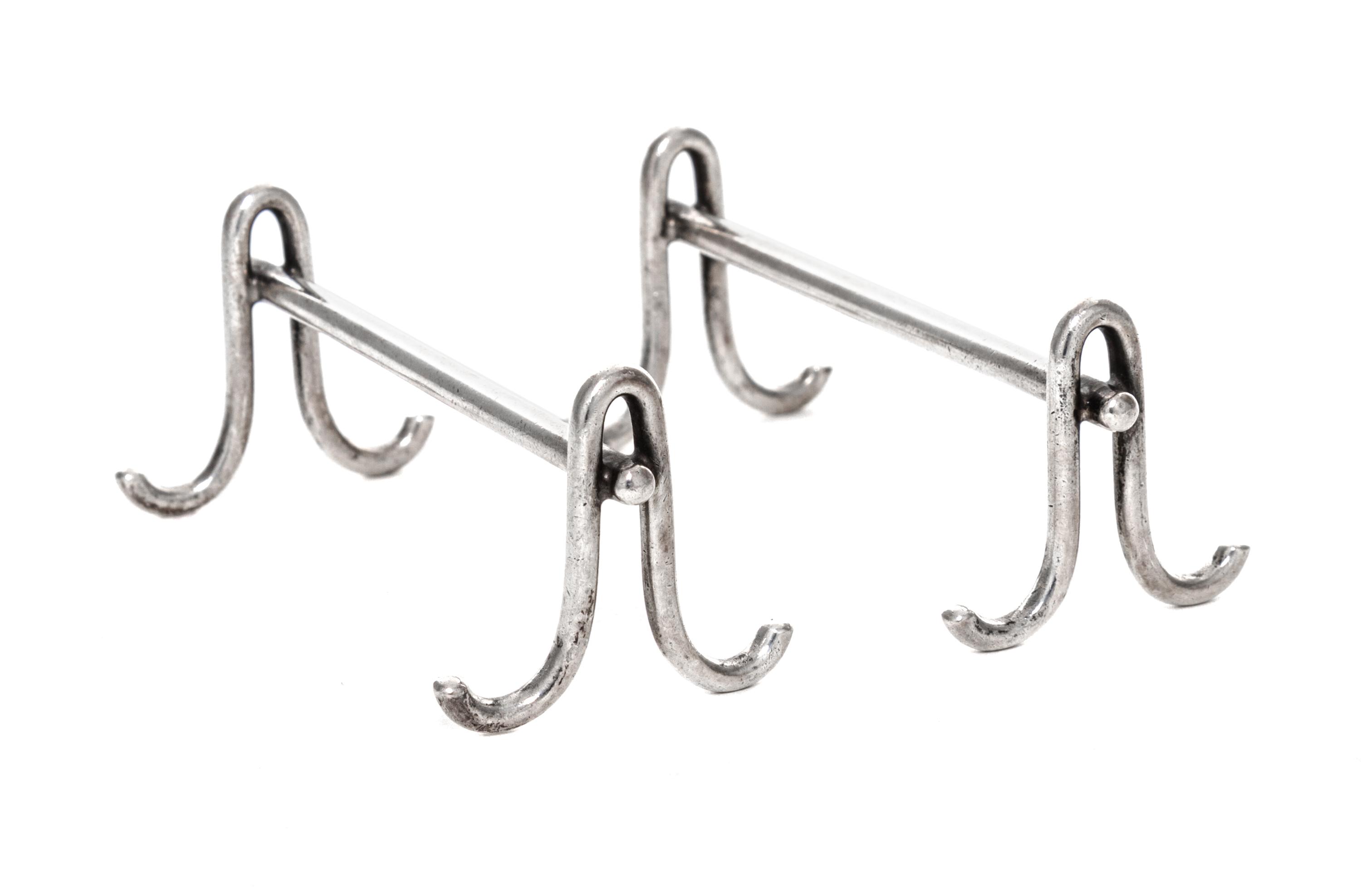 A Pair of American Silver Knife Rests, Gorham Mfg. Co., Providence, RI, each raised on two shaped supports