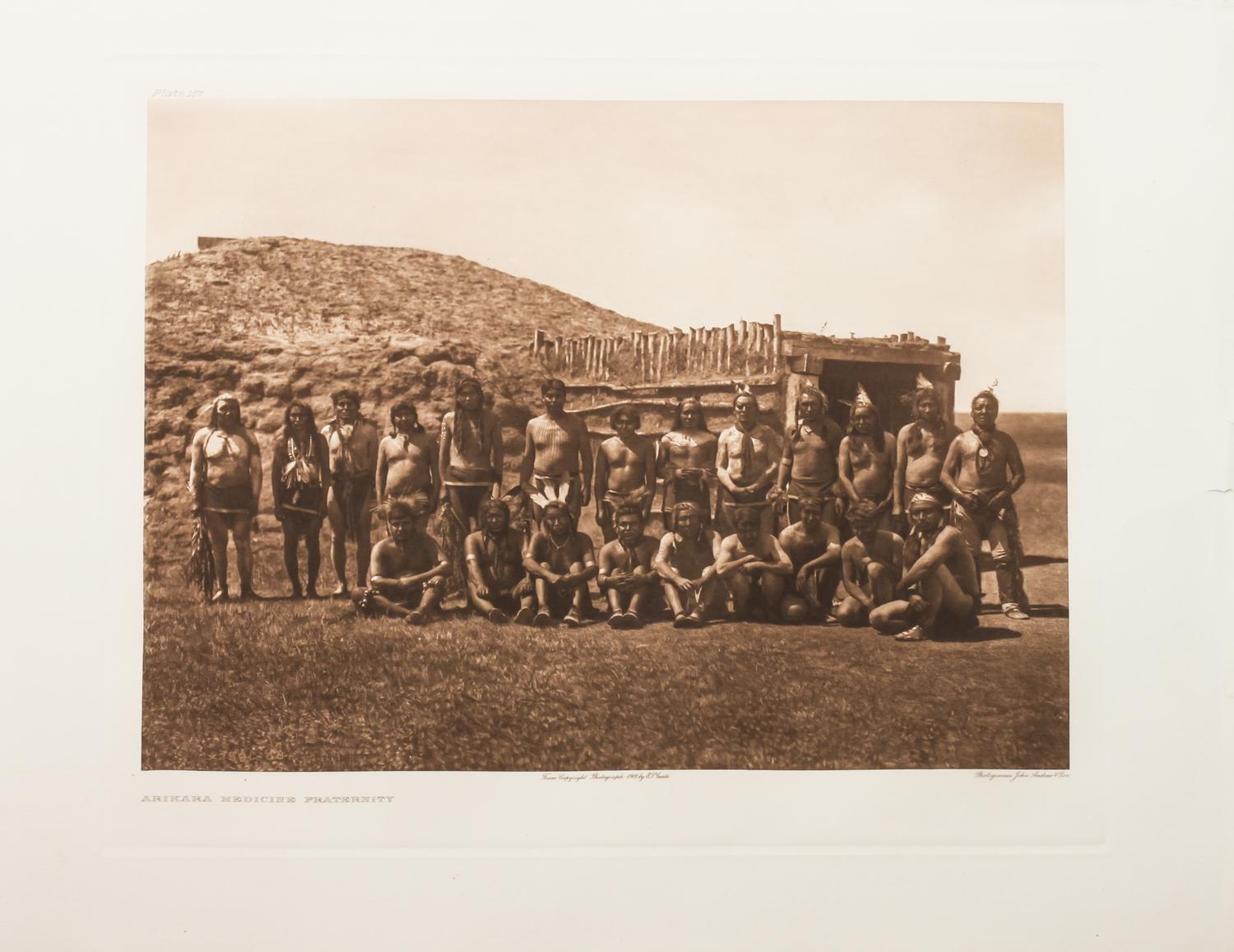 Edward Sheriff Curtis, (American, 1868-1952), three photogravuresShot in the Hand-Apsaroke Plate 133, Arikara Medicine Fraternity Plate