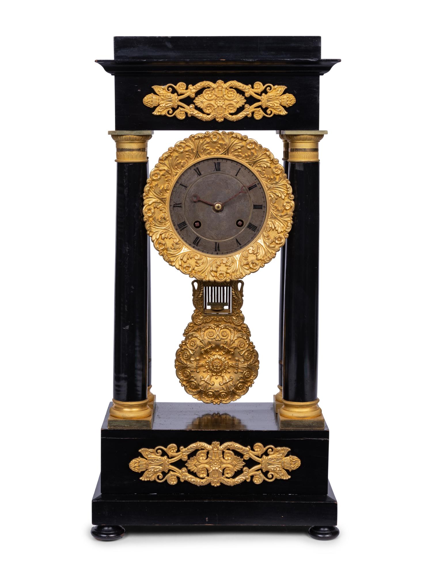 A Charles X Gilt Bronze Mounted Ebonized Portico Clock
