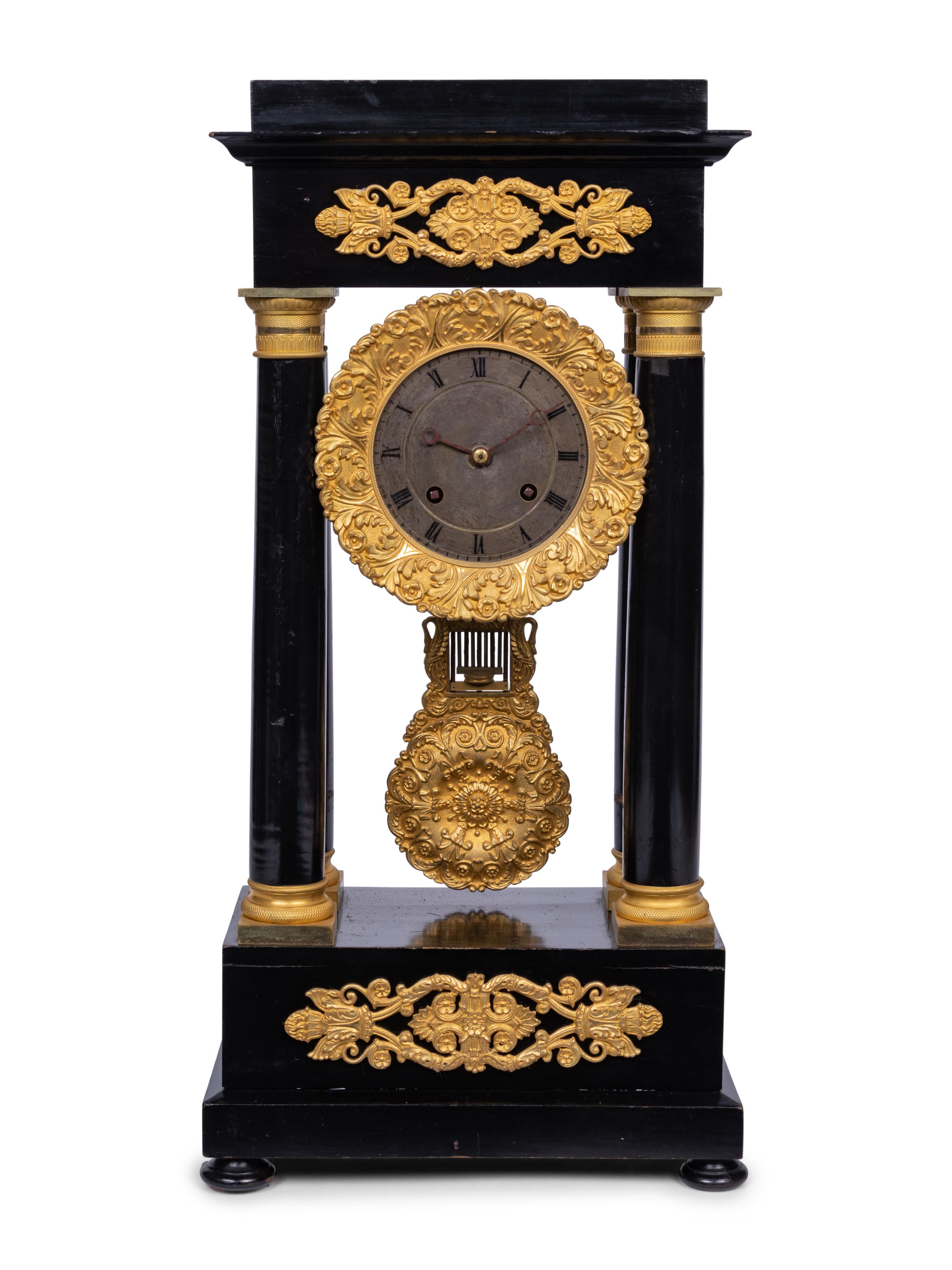 A Charles X Gilt Bronze Mounted Ebonized Portico Clock