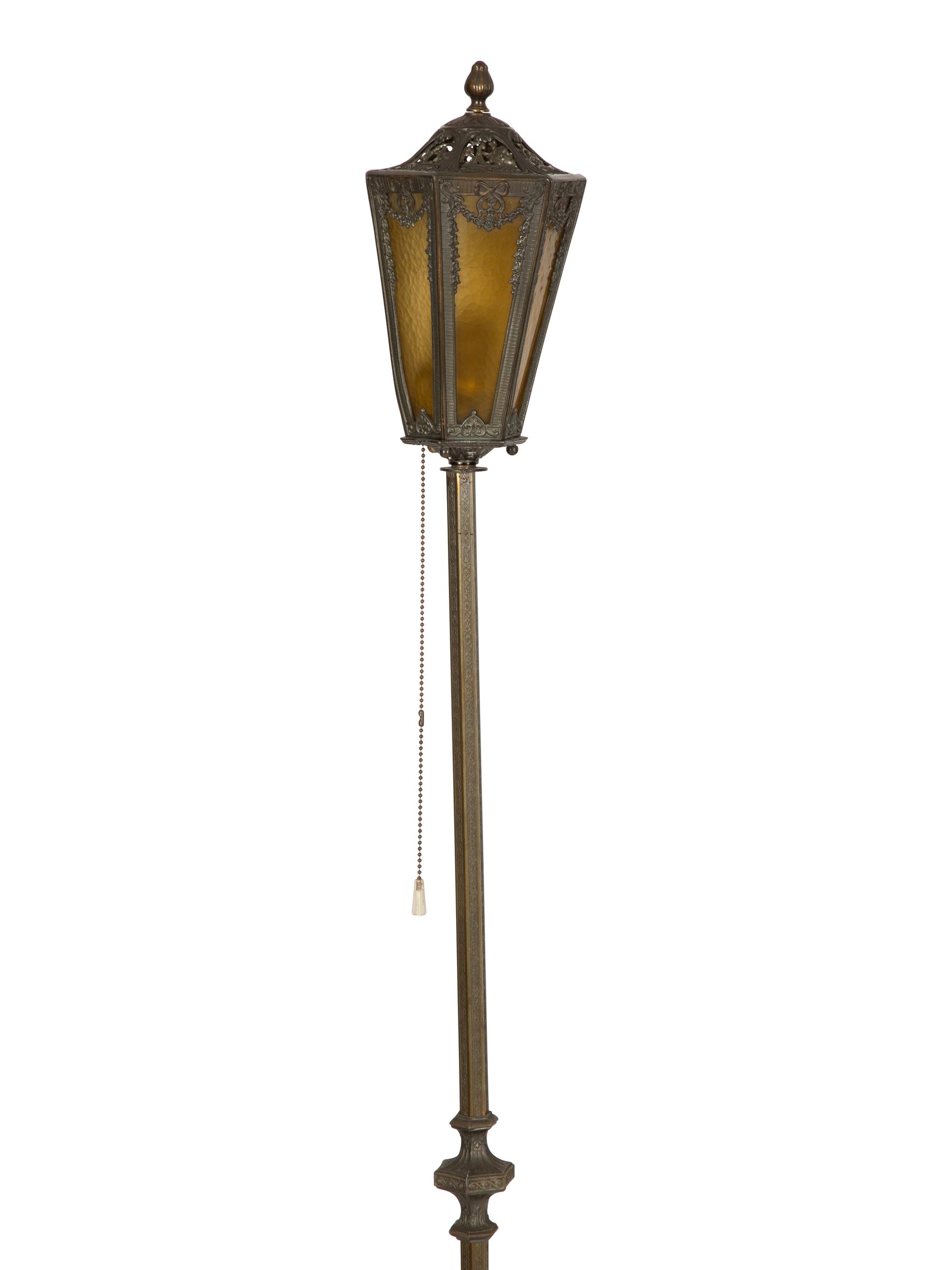 A Pair of Patinated Metal Lantern Style Floor Lamps