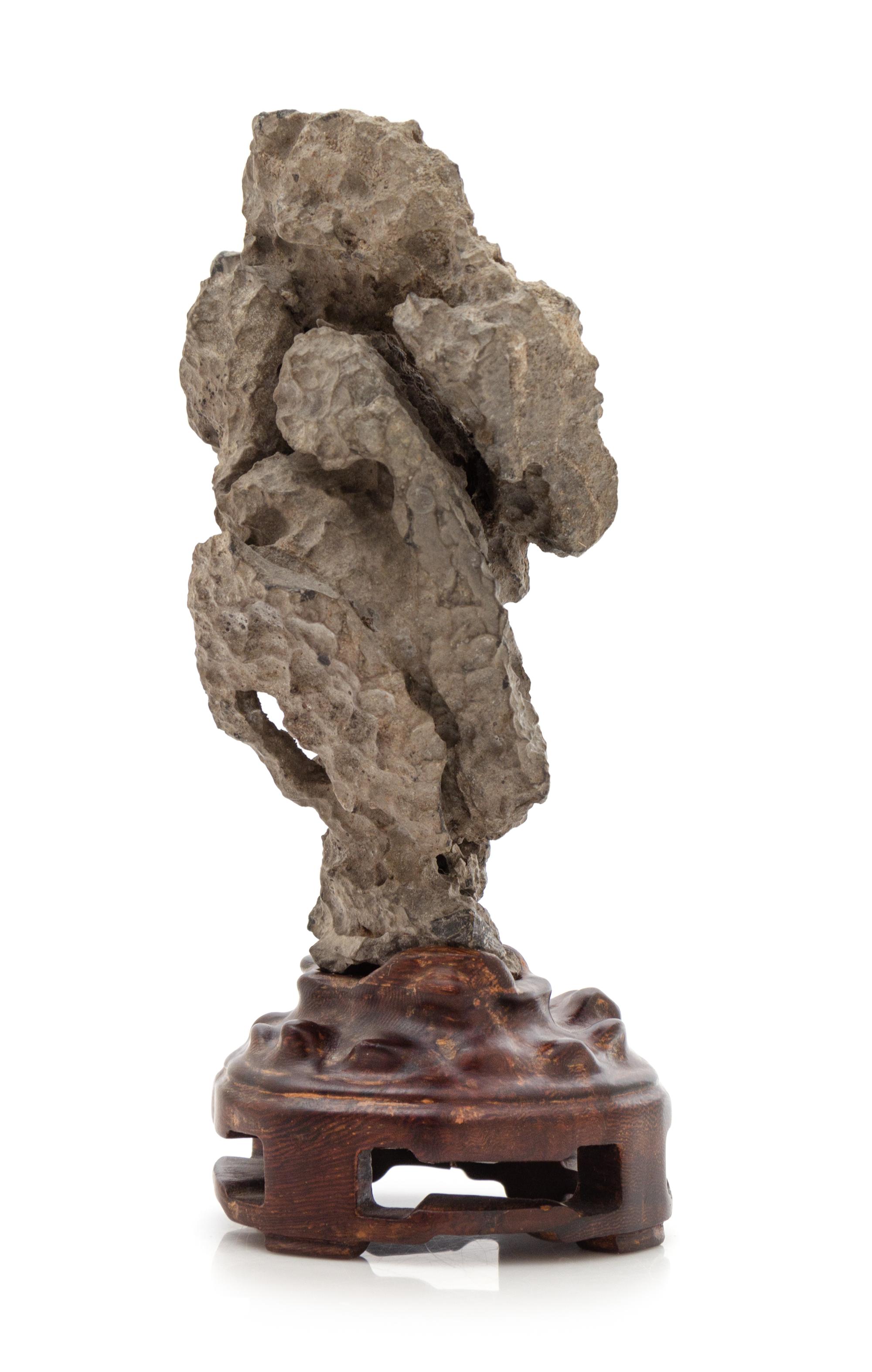 A Chinese Ying Scholar's Rock Height overall 7 inches. — 20TH CENTURY