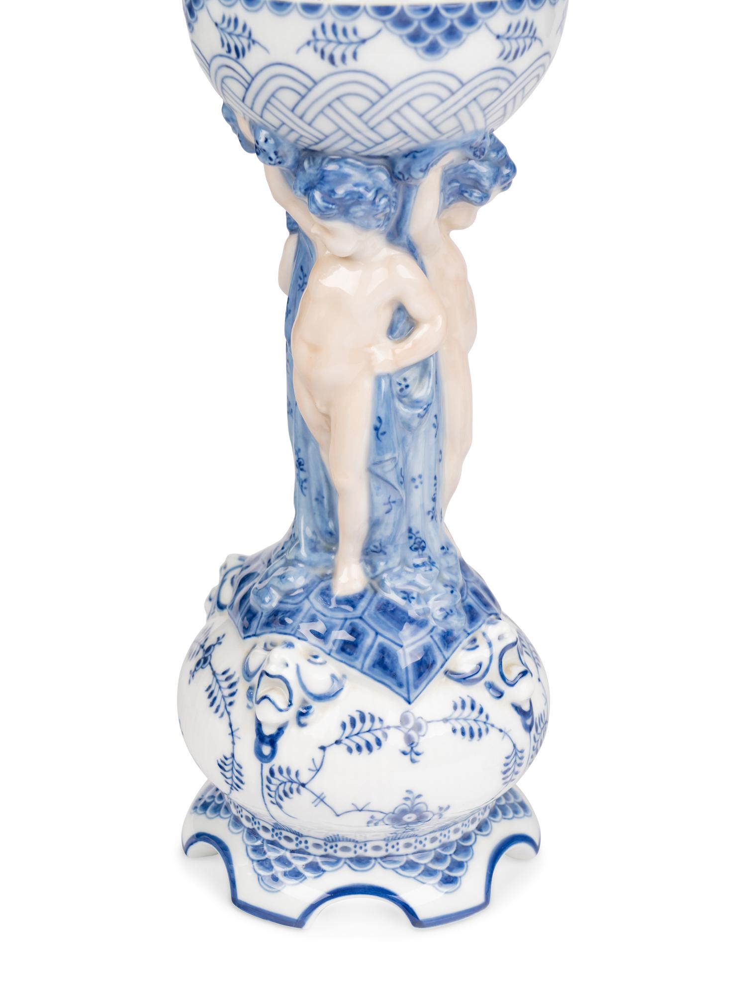 An Assembled Royal Copenhagen Blue Fluted Full Lace Porcelain Table Garniture