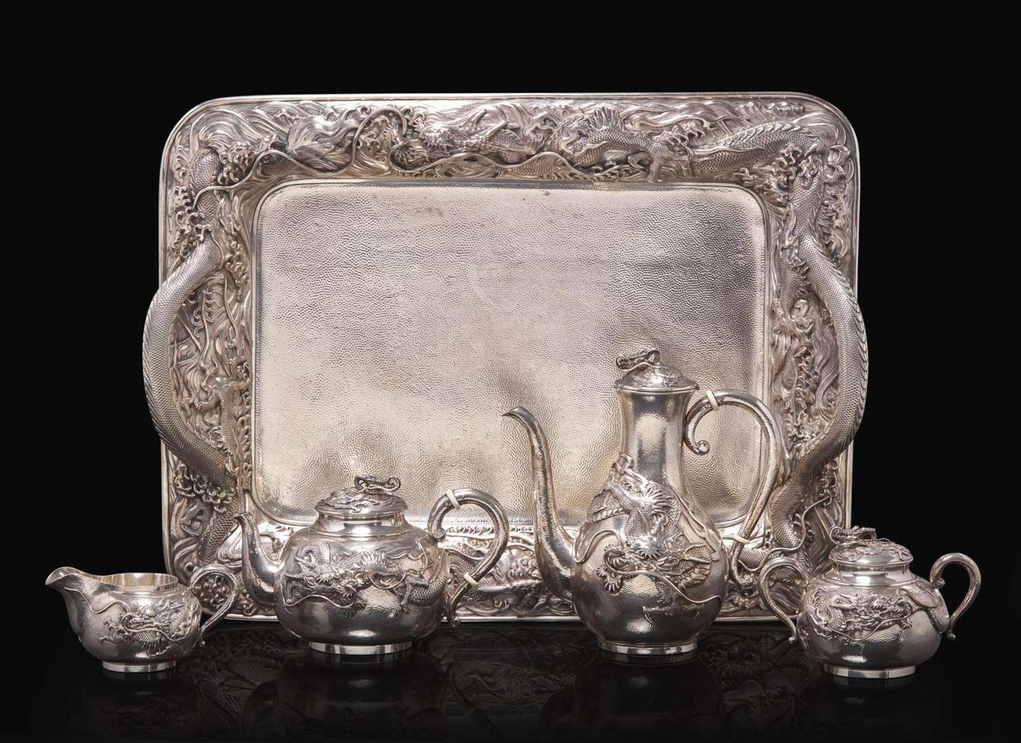 An impressive Japanese export silver four-piece "Dragon" tea and coffee service with tray, retailed by Arthur & Bond, Yokohama, late 19th/early 20th century 日式銀質咖啡器茶具四件及托盤 十九世紀末或二十世紀初