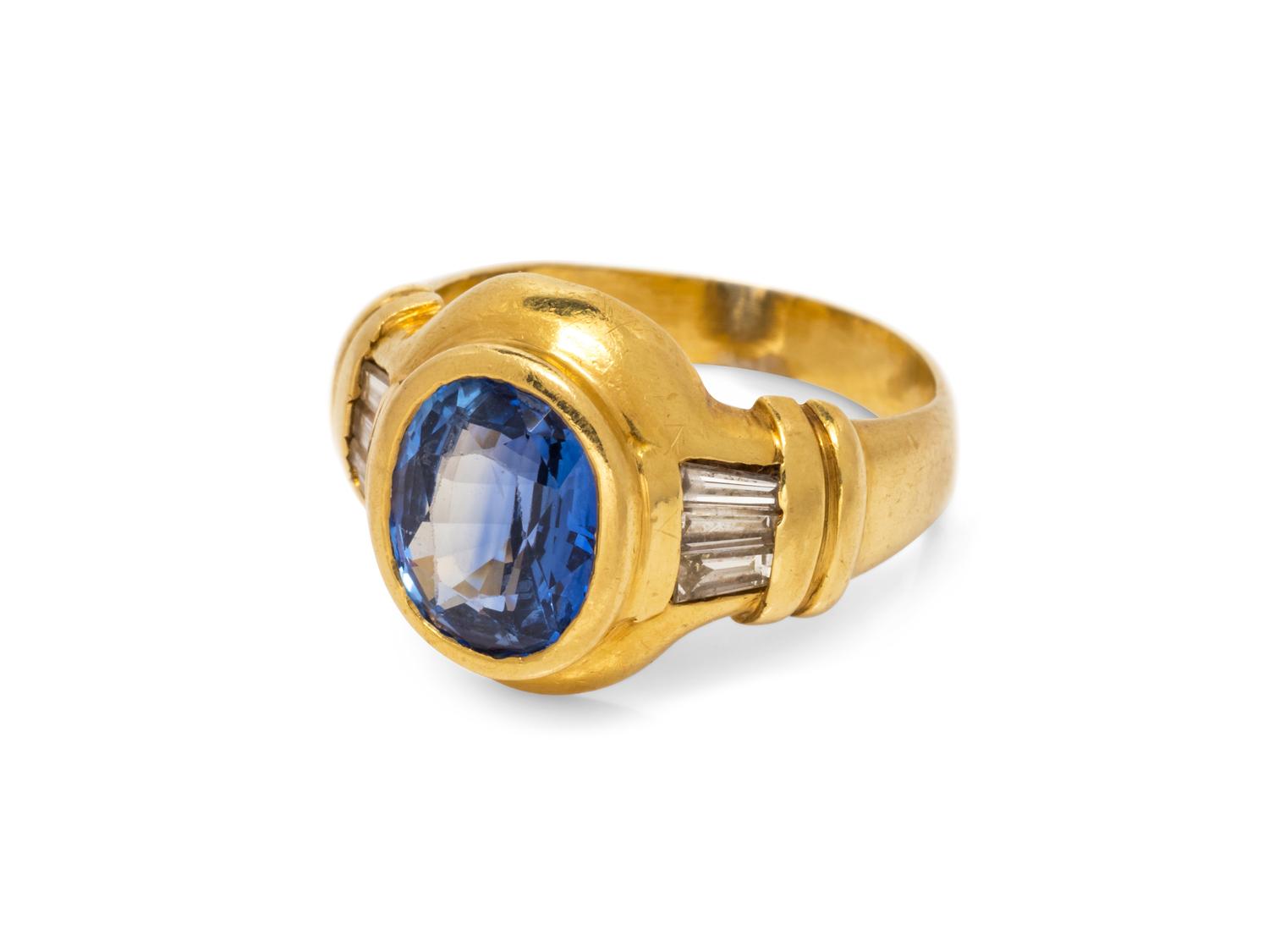 An 18 Karat Yellow Gold Sapphire and Diamond Ring,