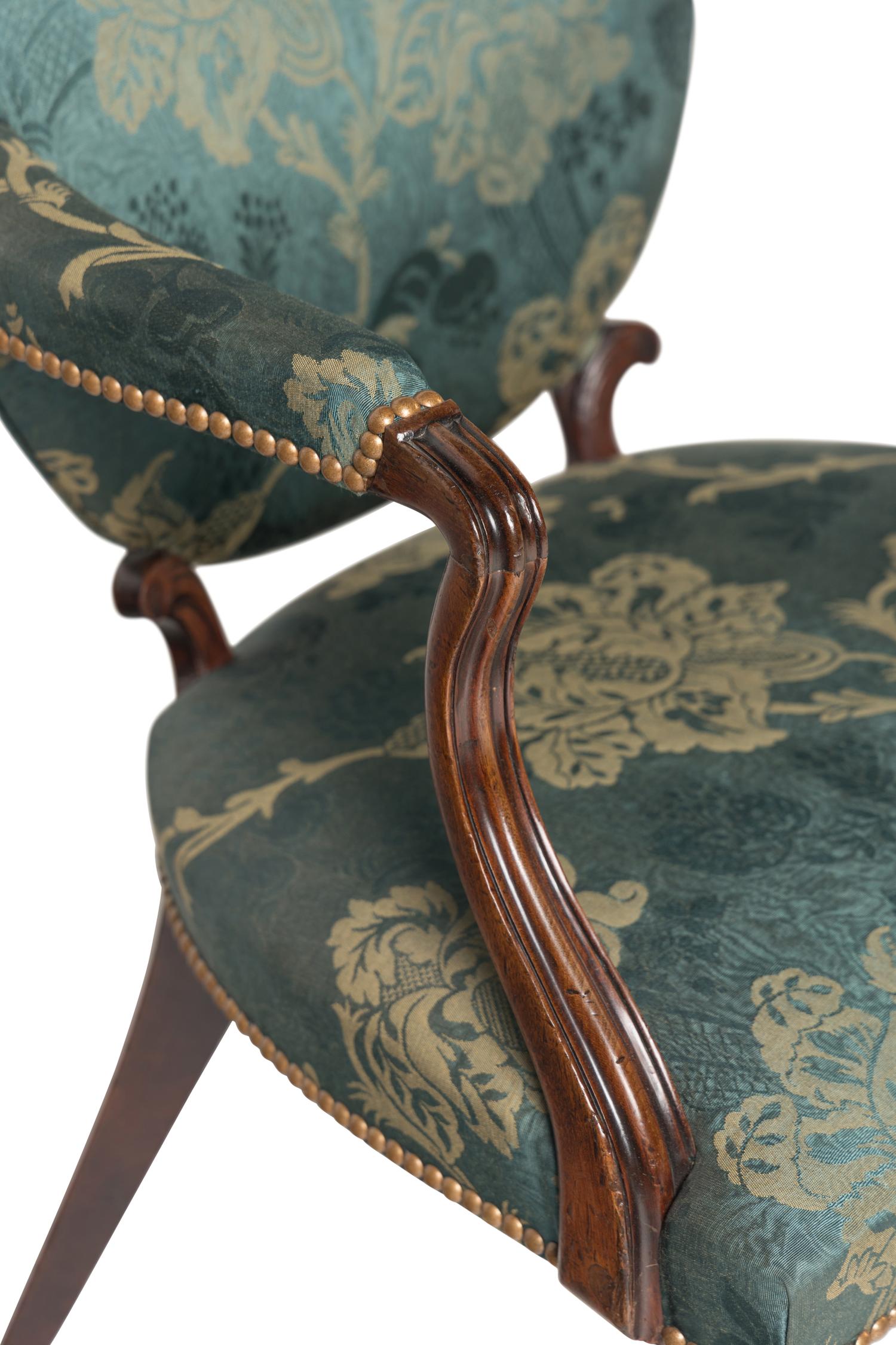 A Pair of George III Mahogany Armchairs