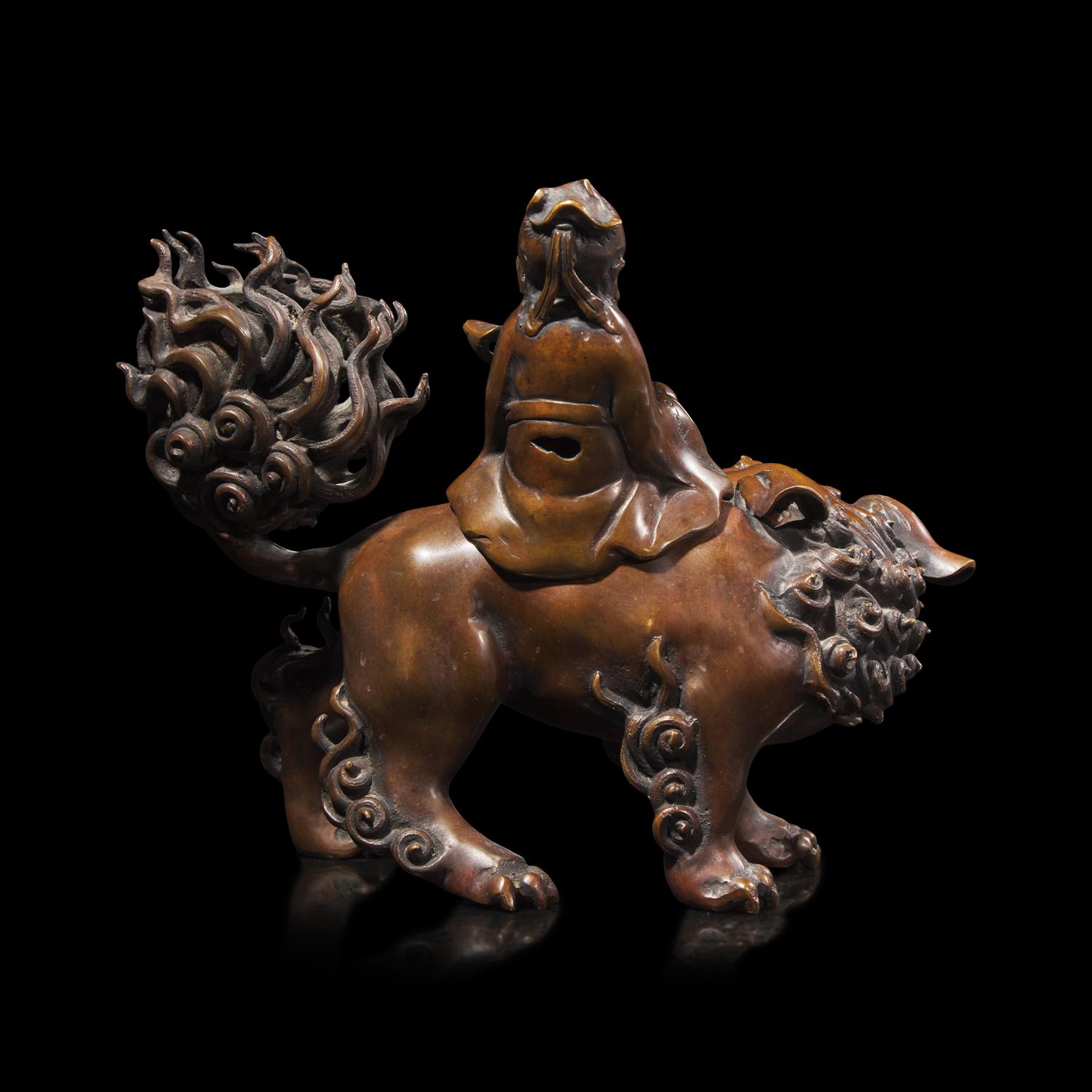 A Patinated Bronze Daoist Immortal Incense Burner, Late 19th Century 19世紀末 仙人乘獅銅香薰
