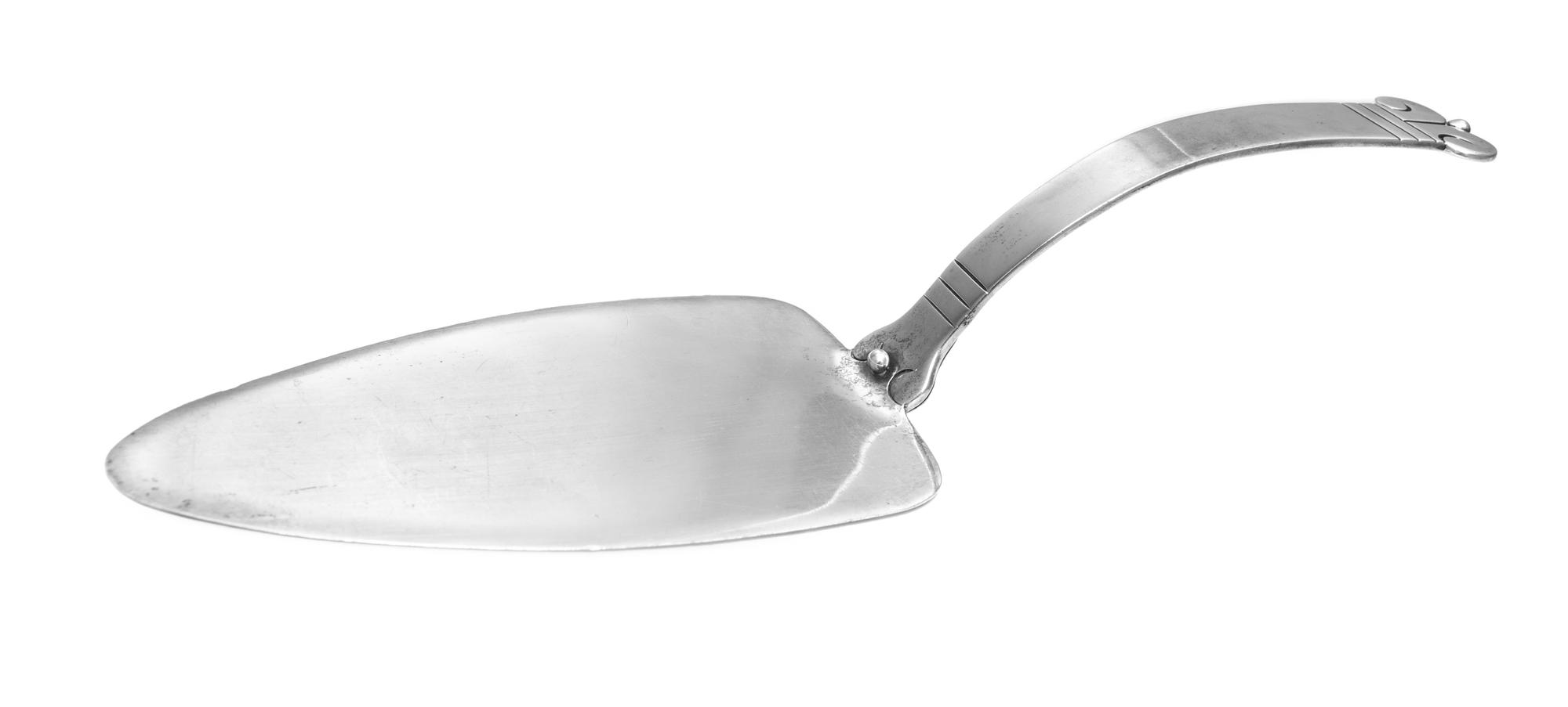 A Mexican Silver Server, Taller Borda, 20th Century, having triangular blade and scrolled handle