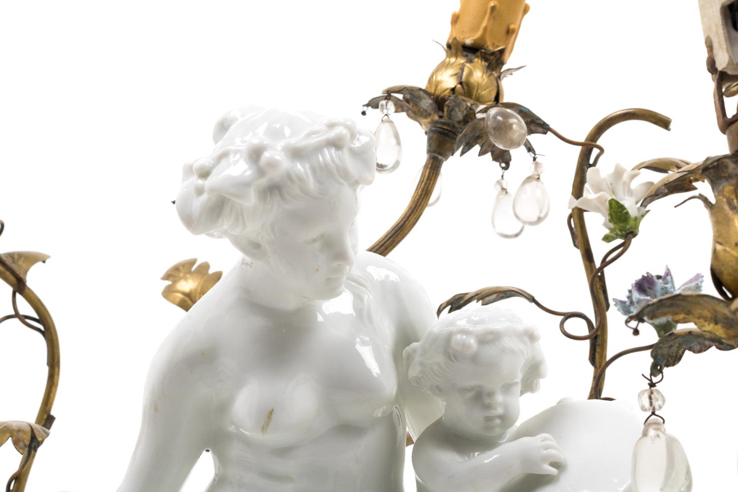 A Gilt Metal Mounted White Glazed Porcelain Figural Group after Clodion Mounted as a Lamp