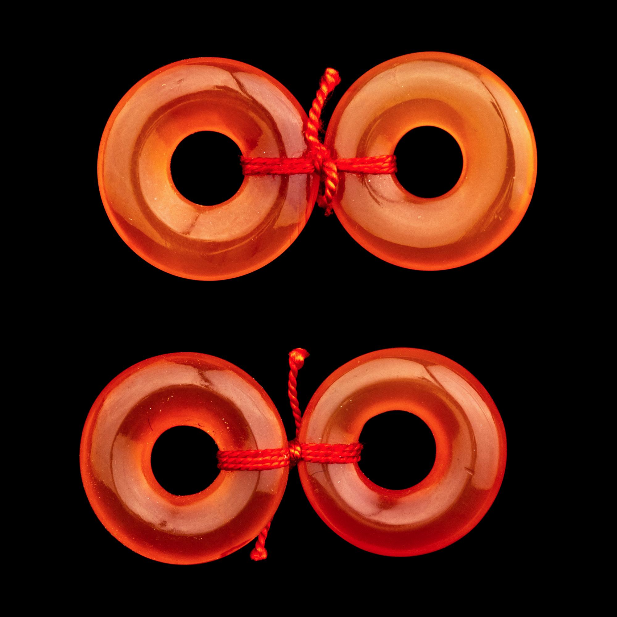 A Group of Chinese Red Carnelian and Coral Pendants