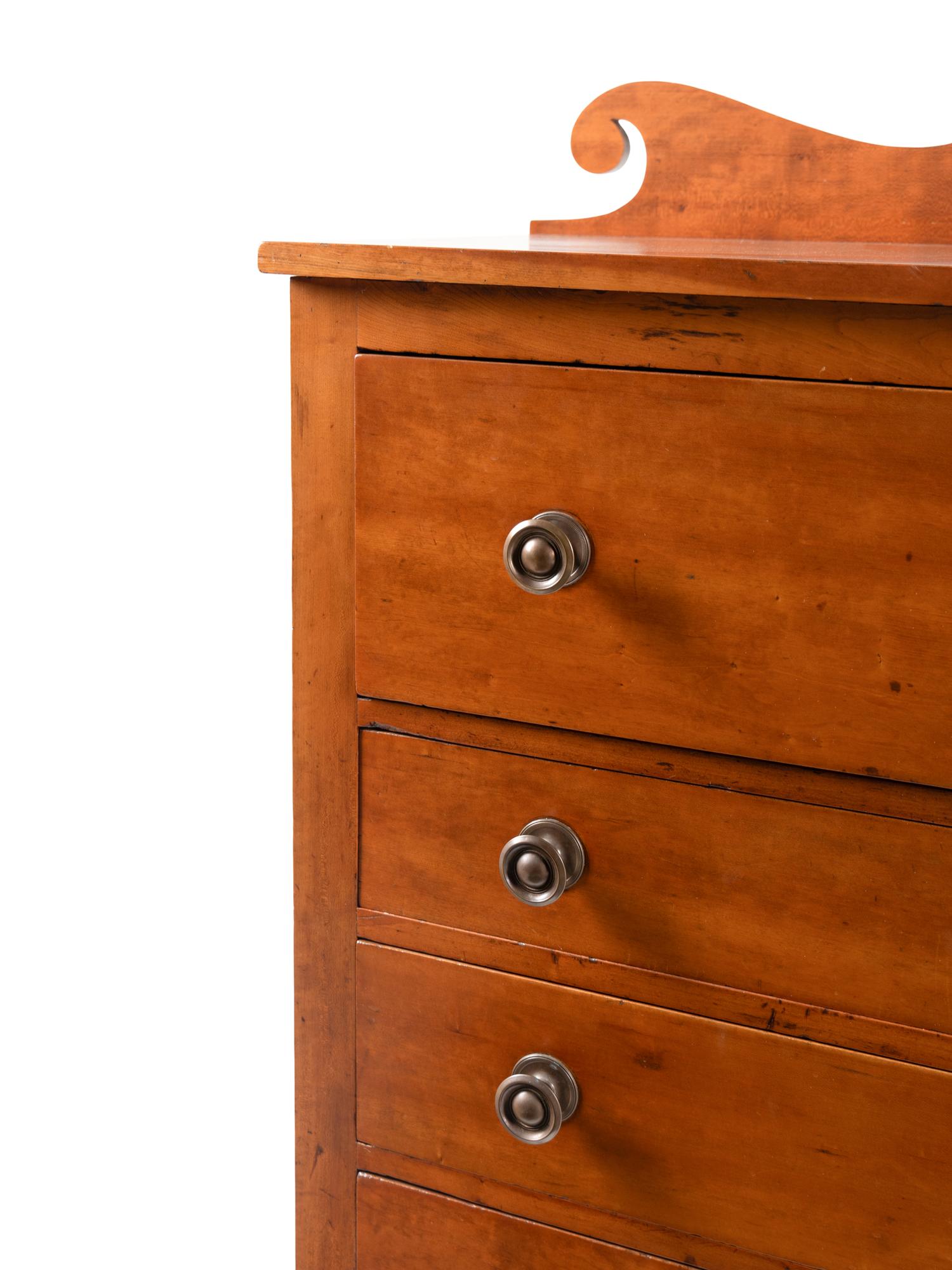 A Late Classical Carved Cherrywood Chest of Drawers