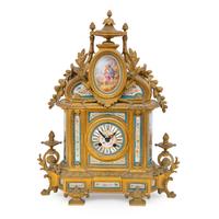 A Louis XVI Style Gilt Bronze and Porcelain-Mounted Mantel Clock