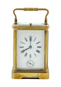 A French Gilt Bronze Carriage Clock Height 5 3/4 inches.