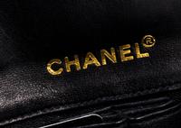 A Chanel Black Lambskin Chocolate Bar Flap Handbag, 10.5" x 5.5" x 1.5"; Strap drop: 12".