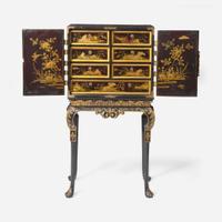 A Chinese Export gilt-decorated black lacquer table cabinet on a George I gilt-decorated and ebonized stand 18th century