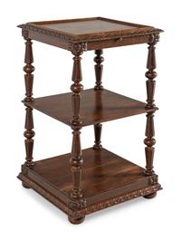 A Continental Carved Oak Etagere