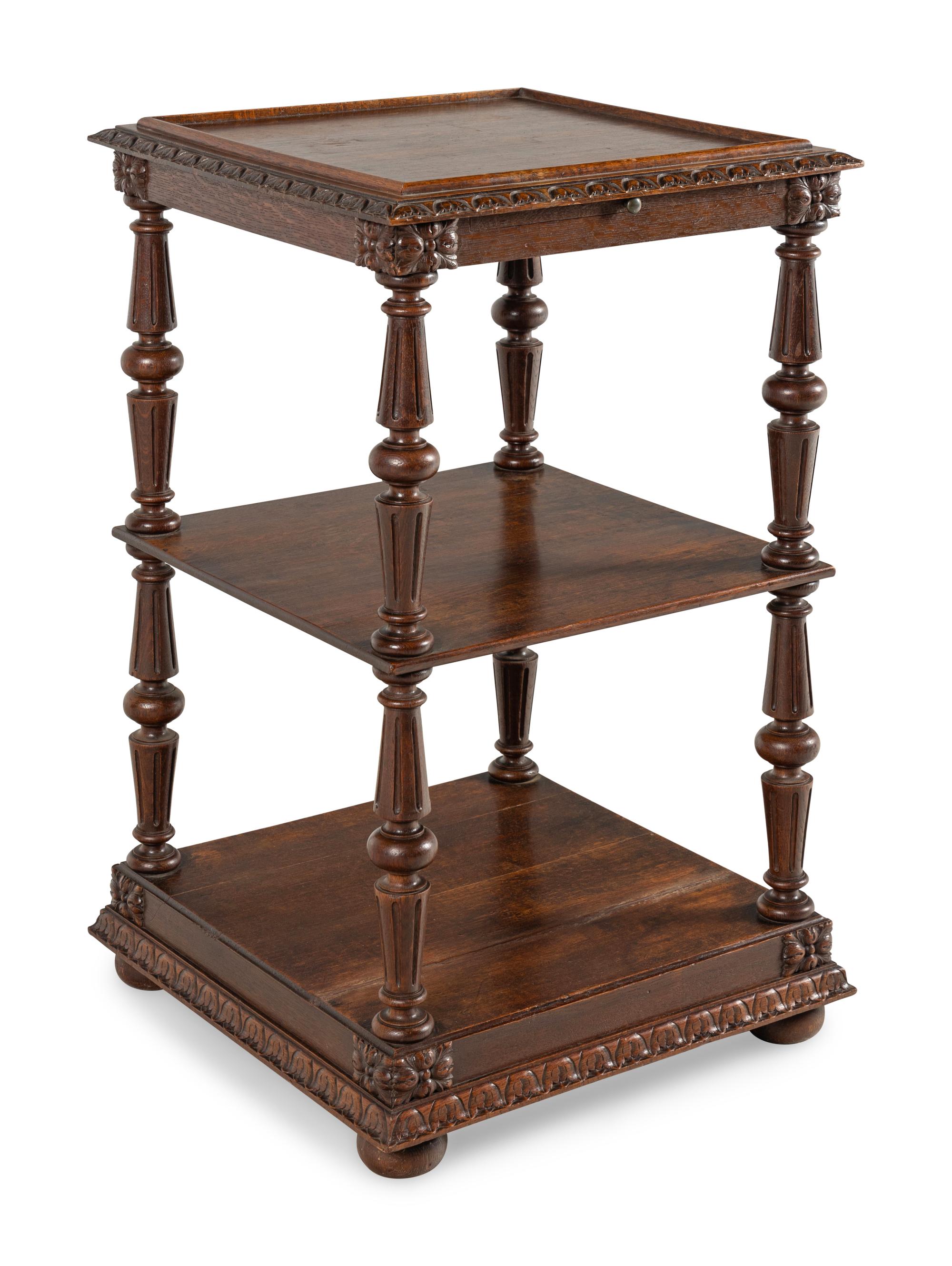 A Continental Carved Oak Etagere