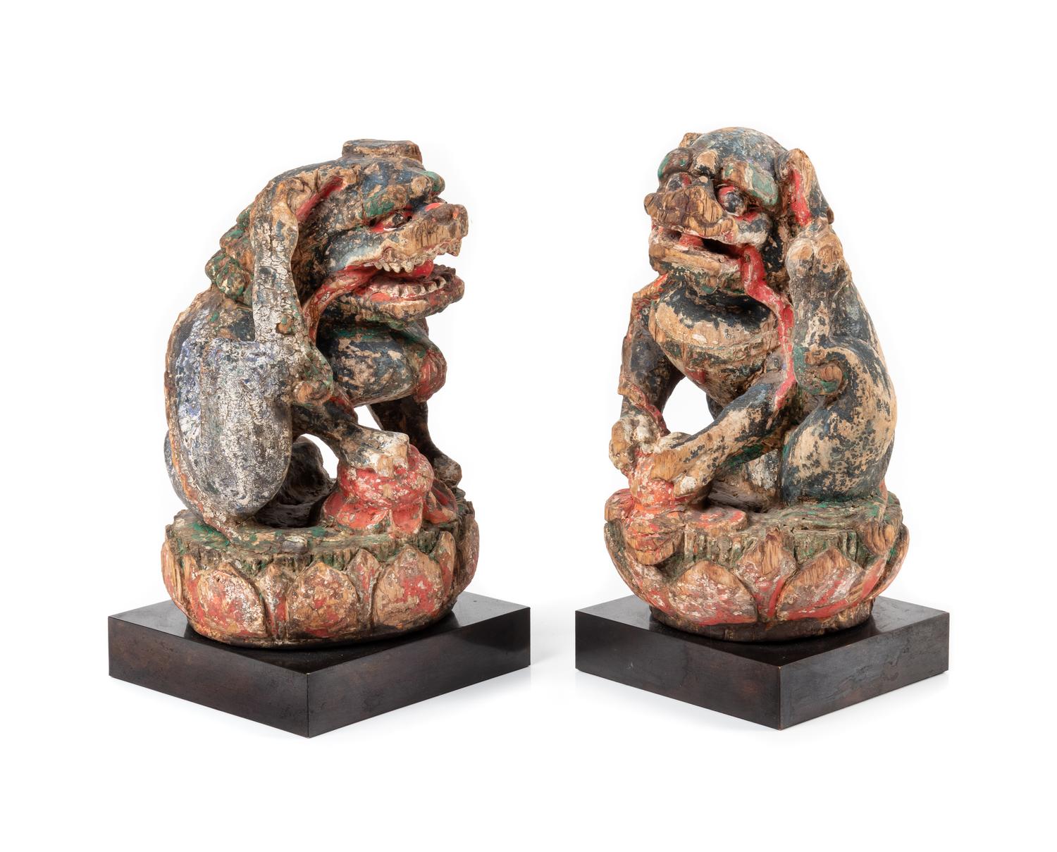 A Pair of Chinese Polychrome Painted Wood Figures of Fu Lions