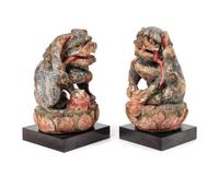 A Pair of Chinese Polychrome Painted Wood Figures of Fu Lions