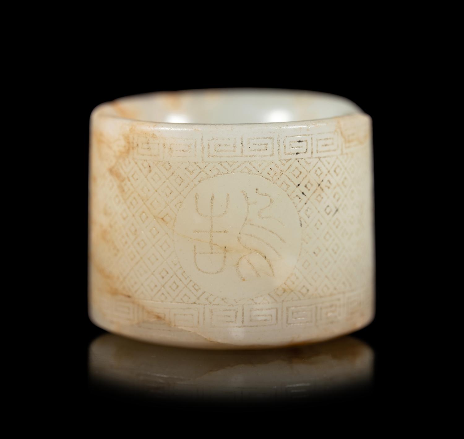 An Incised White Jade Archer's Ring