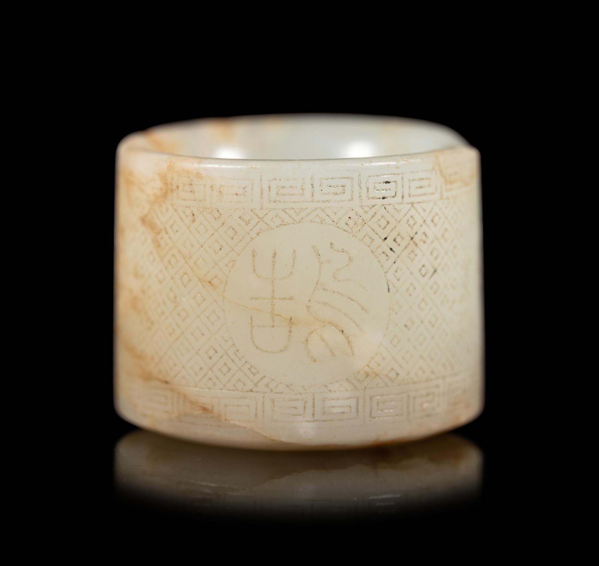 An Incised White Jade Archer's Ring